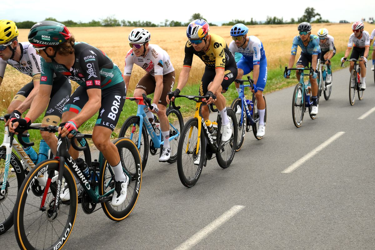 Stan Dewulf of Belgium and Ag2R Citroën Team and Wout Van Aert of Belgium and Team Jumbo-Visma compete during the stage eleven of the 110th Tour de France 2023 a 179.8km from Clermont-Ferrand to Moulins / #UCIWT / on July 12, 2023 in Moulins, France.