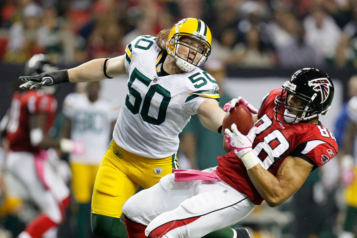 ATLANTA, GA - OCTOBER 09:  Tony Gonzalez #88 of the Atlanta Falcons is tackled by A.J. Hawk #50 of the Green Bay Packers at Georgia Dome on October 9, 2011 in Atlanta, Georgia.  (Photo by Kevin C. Cox/Getty Images)