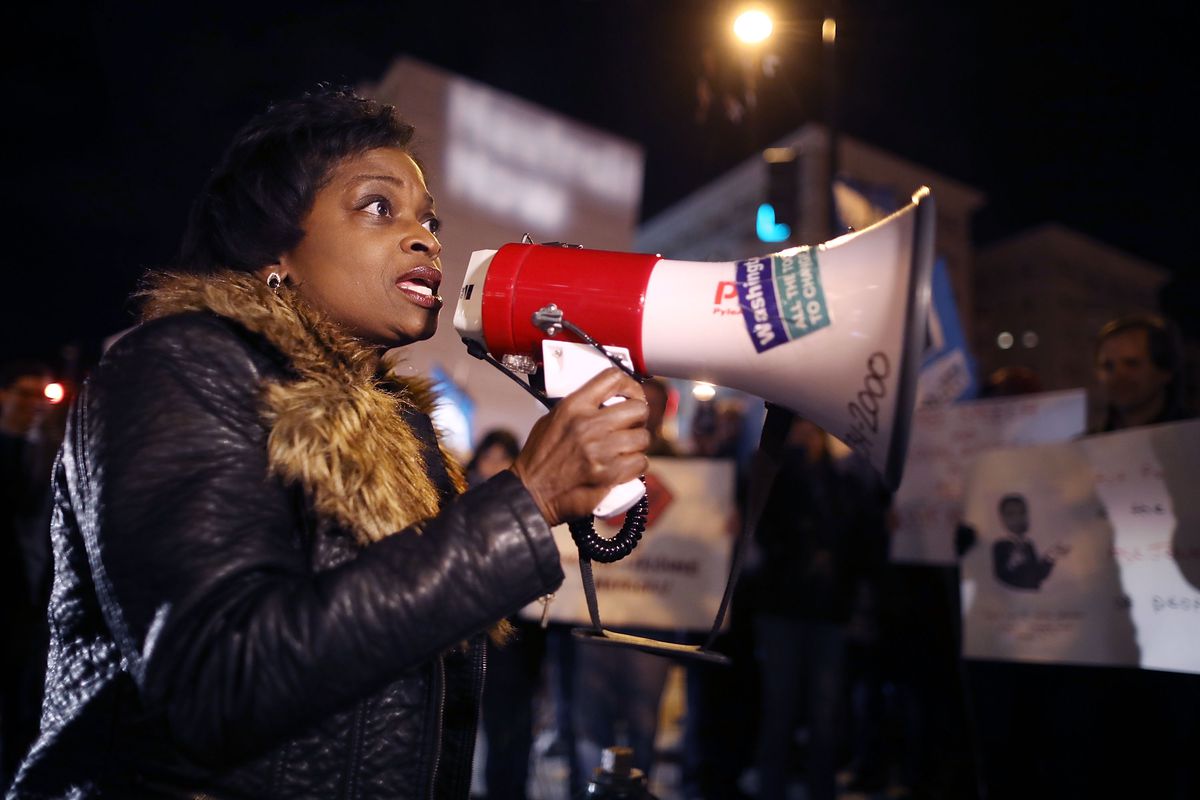 FCC Commissioner Mignon Clyburn speaks into a bullhorn at a net neutrality rally.