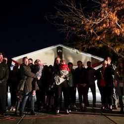Jennie Taylor, center, widow of Maj. Brent Taylor, stands with family members as a vigil forms outside their home in North Ogden on Wednesday, Nov. 7, 2018. Taylor, mayor of North Ogden and a major in the Utah Army National Guard, was killed in Afghanistan on Saturday.