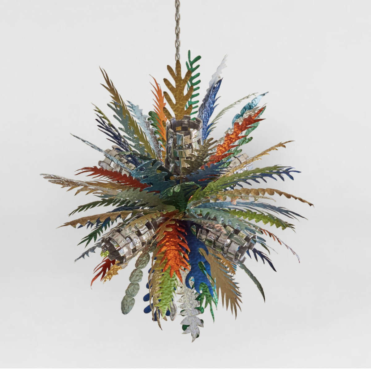 A chandelier composed of multi-color, metallic leaves