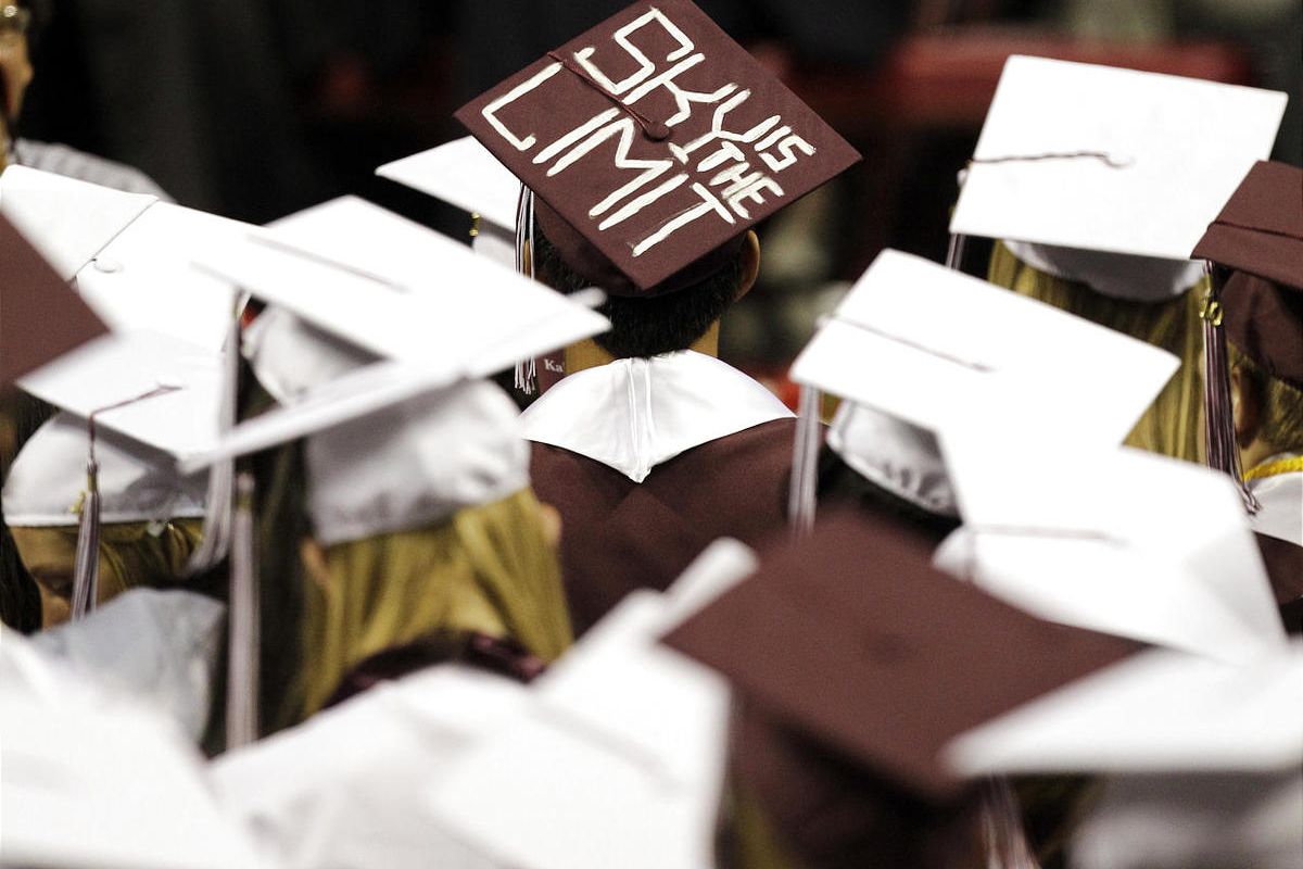 In this June 7, 2010 photo, graduates listen to the commencement address at  Kalamazoo Central High School in Kalamazoo, Mich. States across the nation are bracing for drops in their high school graduation rates as the nation changes the math used by dist