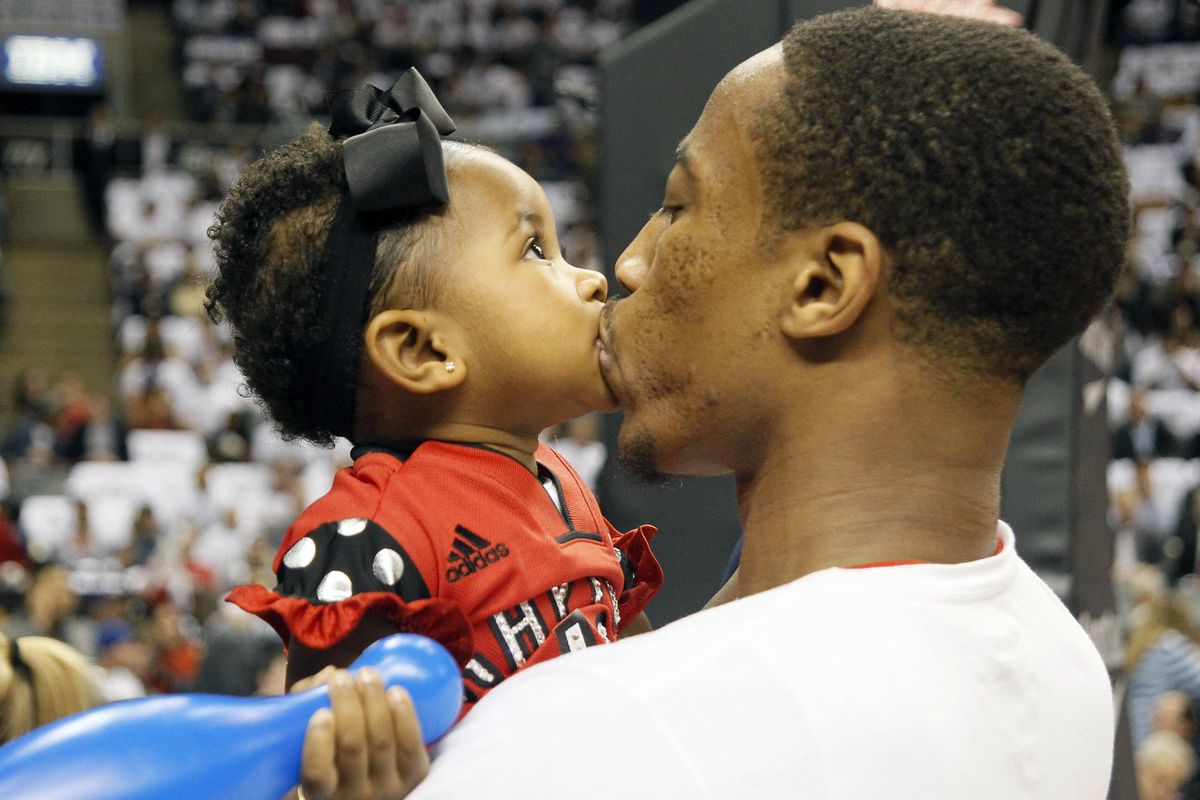 Toronto Raptors guard DeMar DeRozan kisses his daughter Diar prior to a game against the Atlanta Hawks