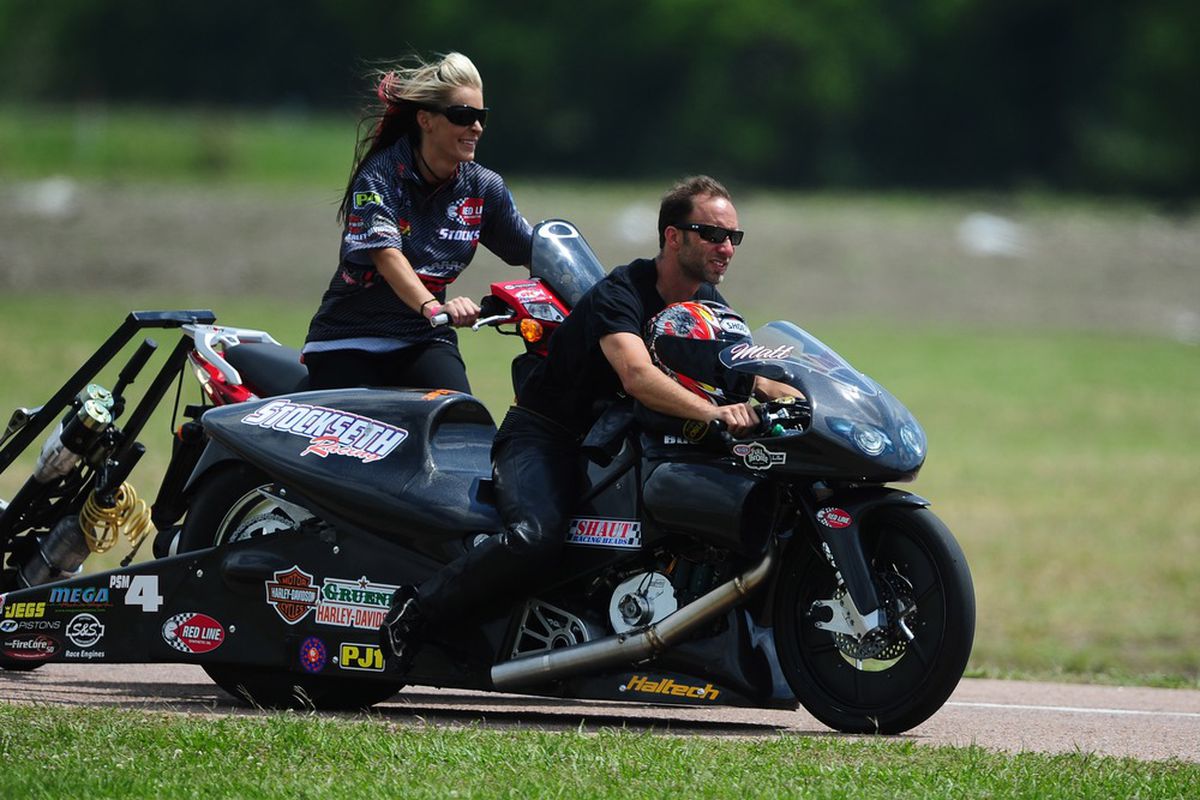 The NHRA Pro Stock Motorcycle husband-wife team of Angie Smith and Matt Smith experienced a few scary moments during Saturday qualifying for the Summit Racing Equipment Nationals at Norwalk, Ohio. ( Photo by Mark J. Rebilas-US PRESSWIRE)