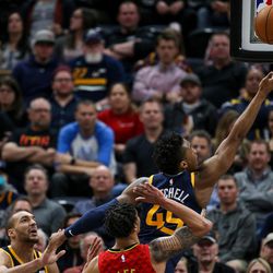 Utah Jazz guard Donovan Mitchell (45) reaches for a layup during the game against the Atlanta Hawks at Vivint Smart Home Arena in Salt Lake City on Tuesday, March 20, 2018.