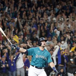 Cal Raleigh #29 of the Seattle Mariners watches his walk-off home run during the ninth inning against the Oakland Athletics