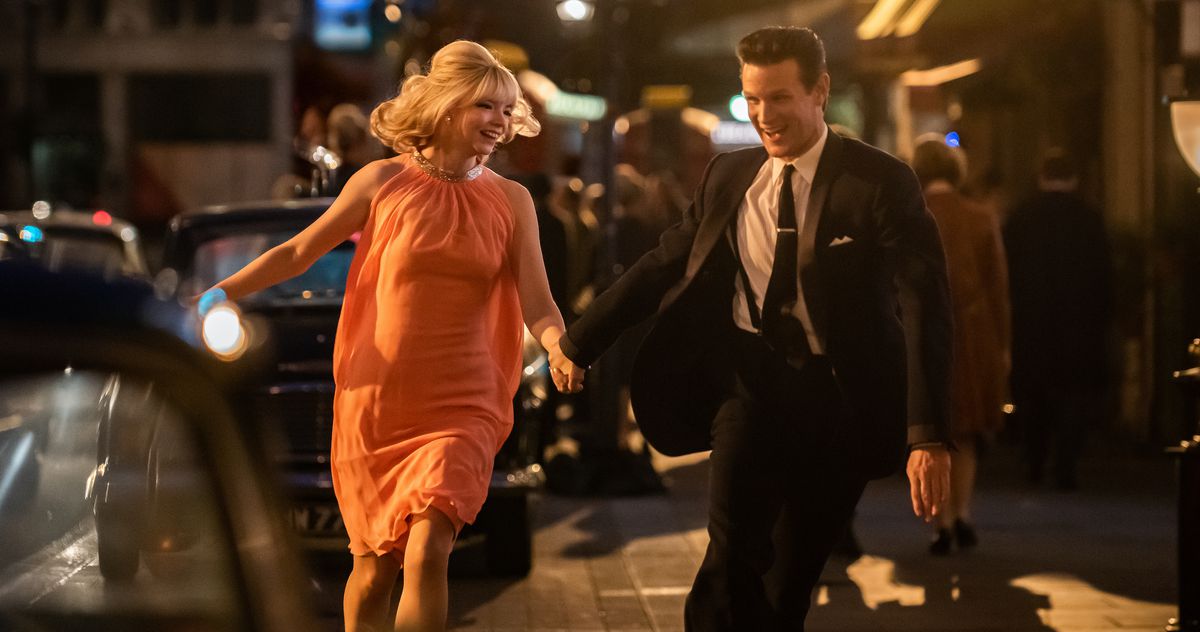 Sandie (Anya Taylor-Joy) and Jack (Matt Smith) skip out into the London street together in Last Night in Soho