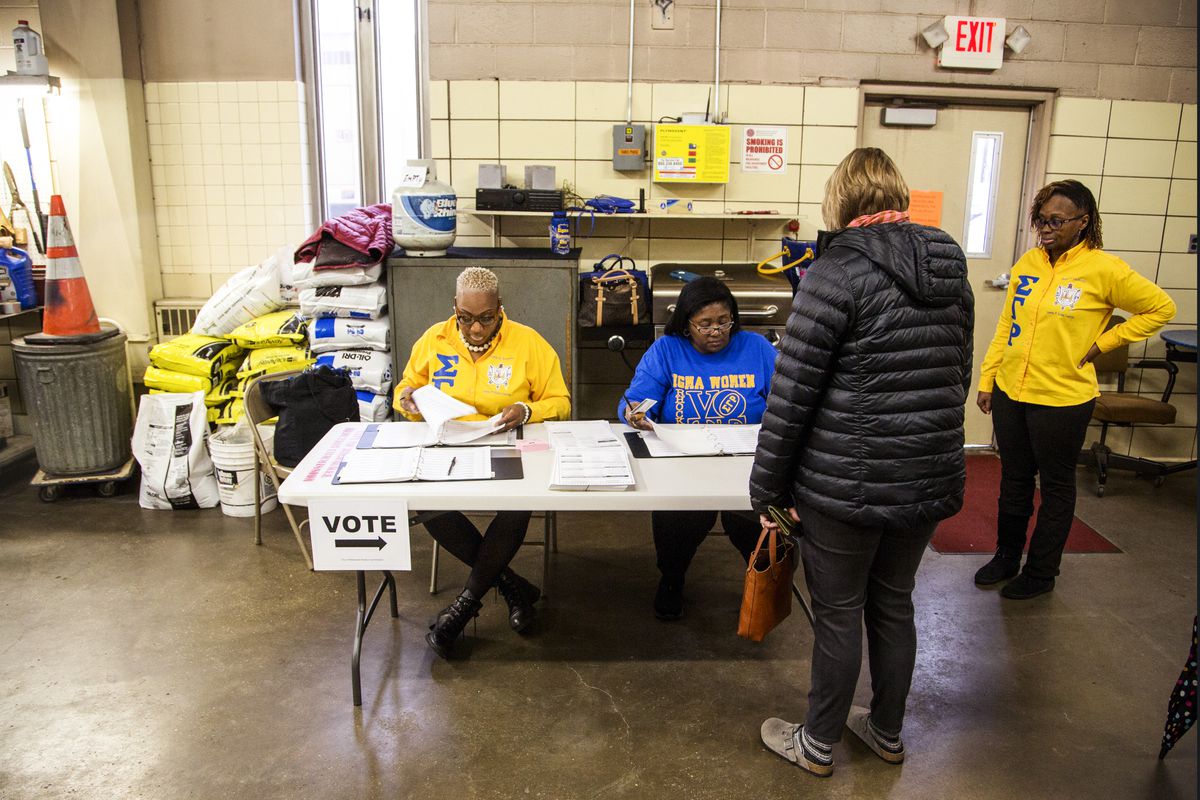 A voter checks in to cast a midterm ballot at the District 5 Ward 83 firehouse in Milwaukee, Wisconsin, on November 6, 2018.
