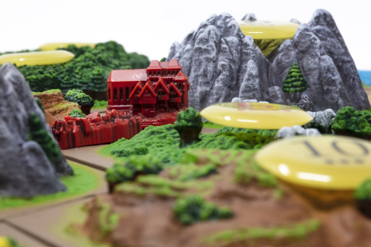 A town between two mountains in Catan 3D.