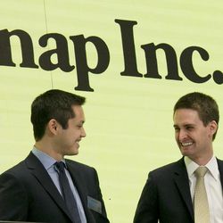 FILE - In this Thursday, March 2, 2017, file photo, Snap co-founders Bobby Murphy, left, and CEO Evan Spiegel ring the opening bell at the New York Stock Exchange as the company celebrates its IPO. Snap Inc. reports earnings, Thursday, Aug. 10, 2017.