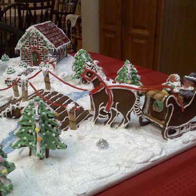 Gingerbread sleigh, reindeer, and Christmas trees.
