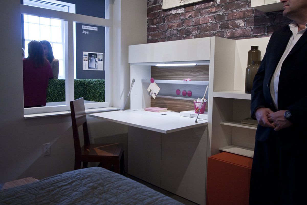 Inside the micro-apartment within the exhibit, a fold-away desk.