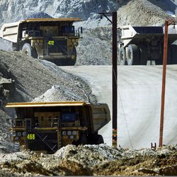 Haul trucks carry up to 340 tons of material at Kennecott's Bingham Canyon Mine on Thursday, April 25, 2013.