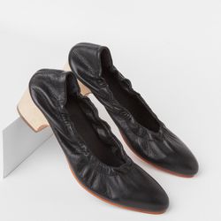 A friendly Rachel Comey style with a low wooden heel and an elongating almond-shaped toe.