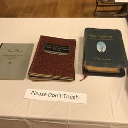 A table displays records and scriptures used by the Ogden LDS Deaf Branch during its 100-year history.