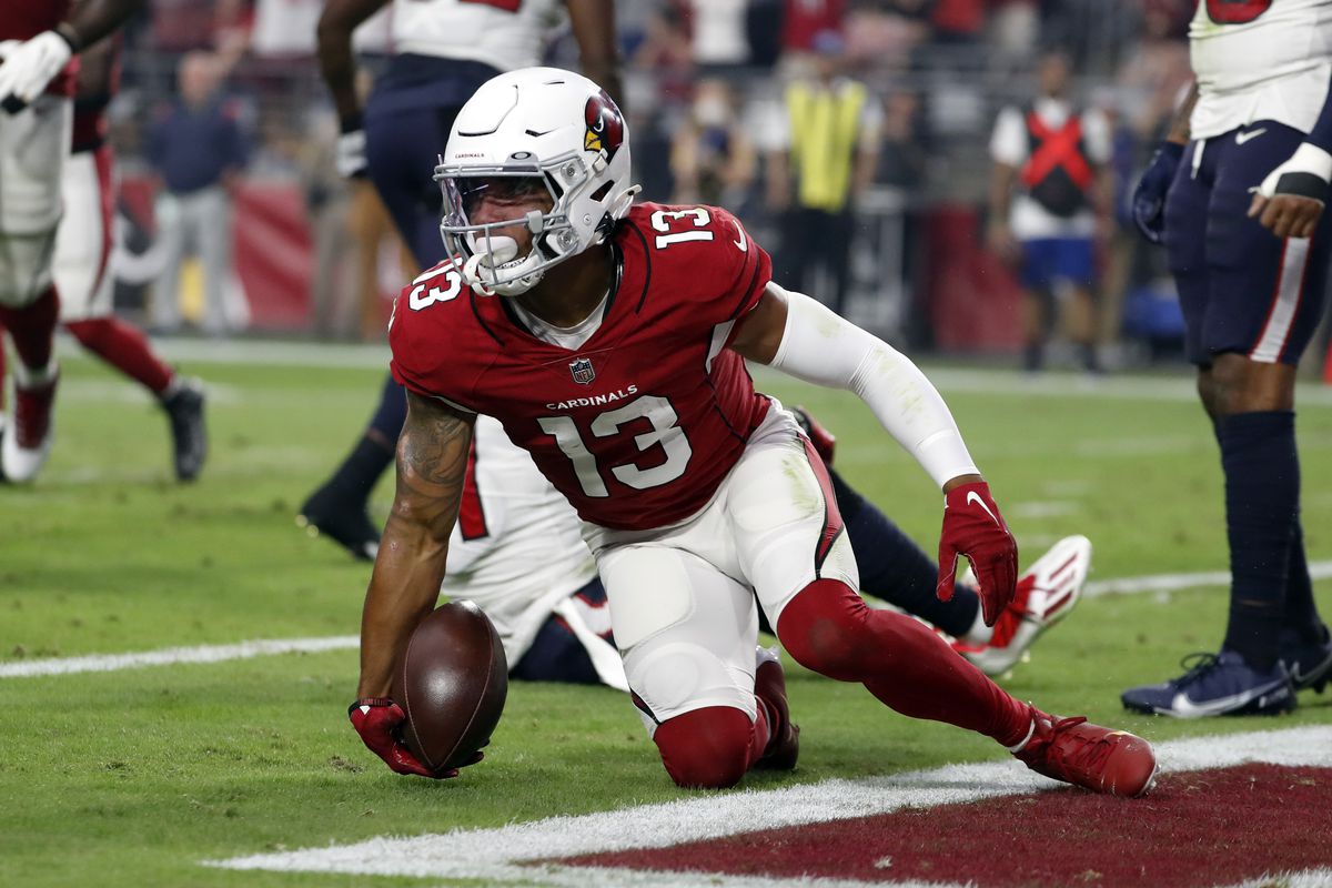Wide receiver Christian Kirk #13 of the Arizona Cardinals scores a touchdown during the game against the Houston Texans at State Farm Stadium on October 24, 2021 in Glendale, Arizona. The Cardinals beat the Texans 31-5.