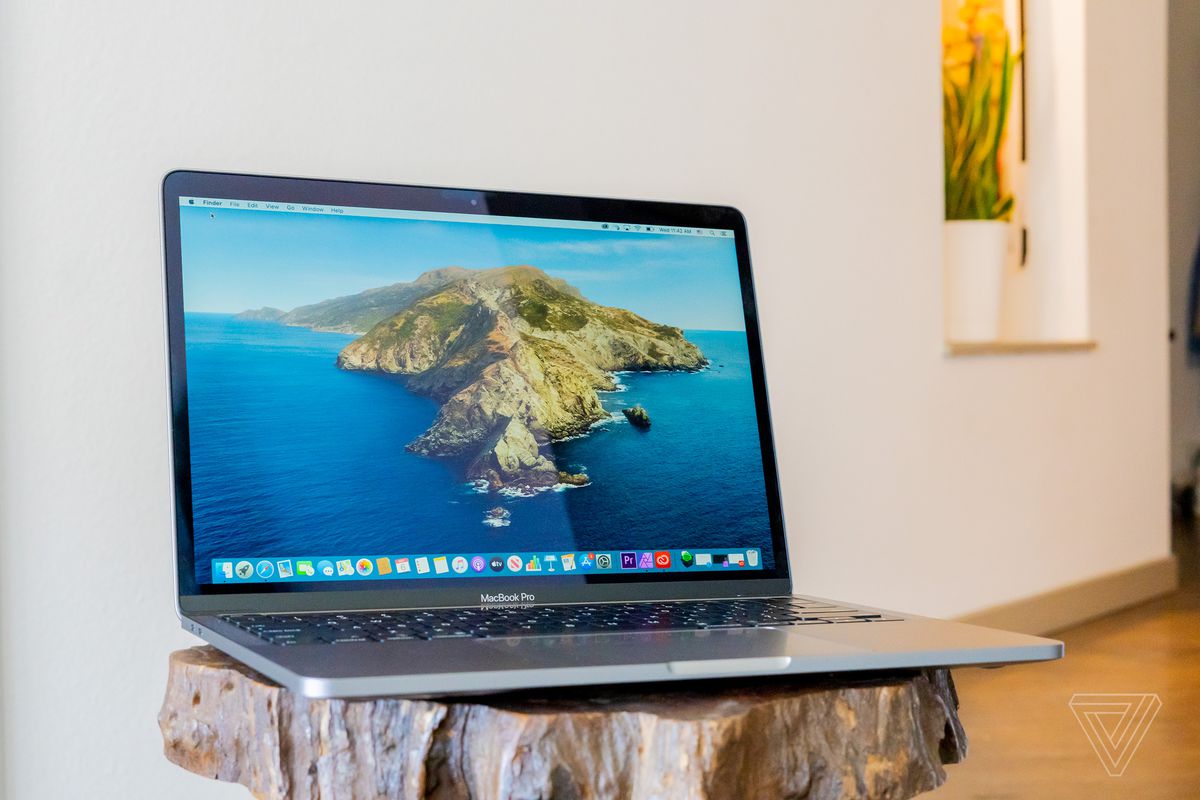 A 2020 Apple MacBook Pro 13-inch on a wooden table