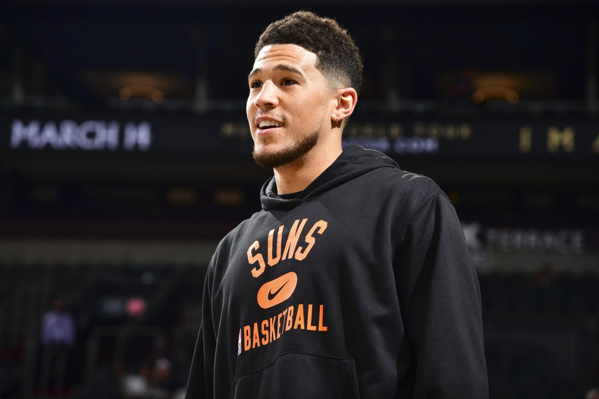 Devin Booker #1 of the Phoenix Suns smiles before the game against the Utah Jazz on February 27, 2022 at Footprint Center in Phoenix, Arizona.&nbsp;