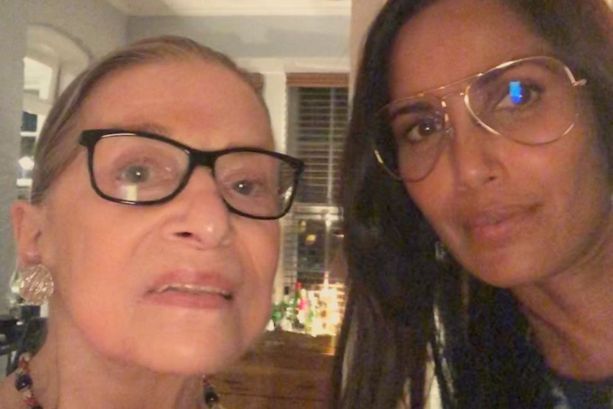 Padma Lakshmi and Ruth Bader Ginsburg in someone’s home, taking a selfie together.