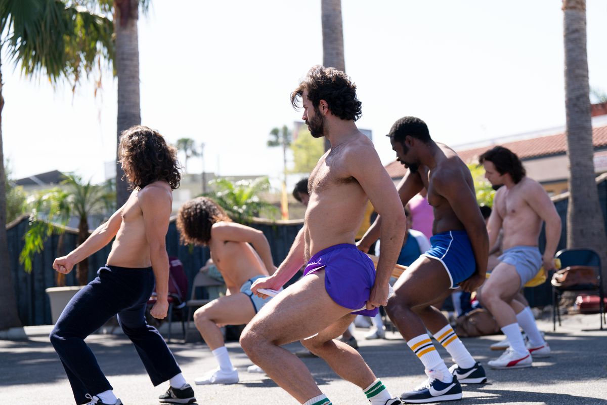 A group of Chippendales dancers practicing moves outside