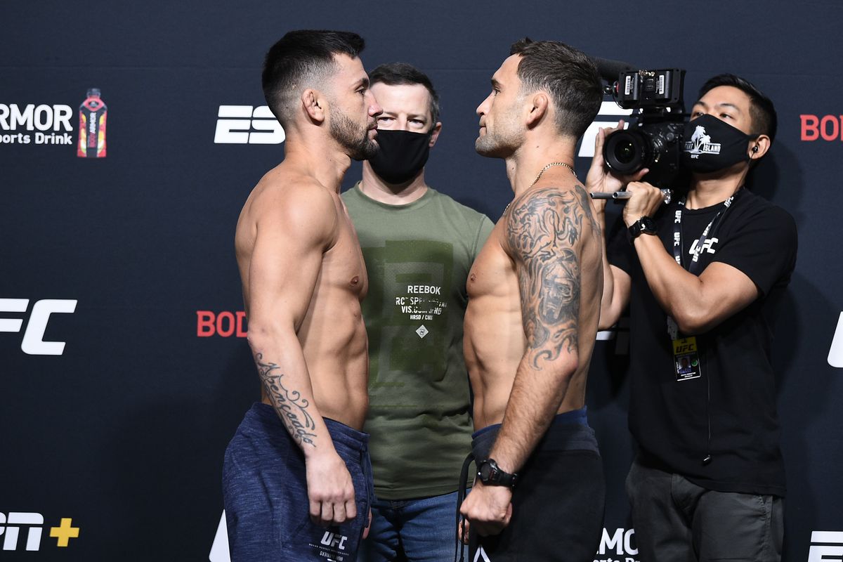 Opponents Pedro Munhoz of Brazil and Frankie Edgar face off during the UFC Fight Night weigh-in at UFC APEX on August 21, 2020 in Las Vegas, Nevada.