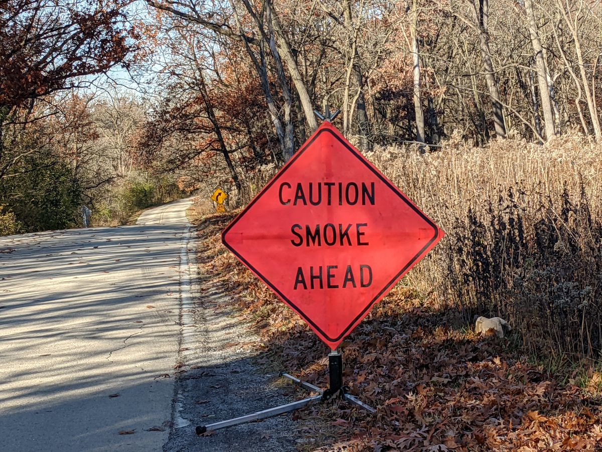 A sign on a road leading to the prescribed burn site at Cap Sauers Holding Nature Preserve and Bergman Slough in the Forest Preserves of Cook County. Credit: Dale Bowman