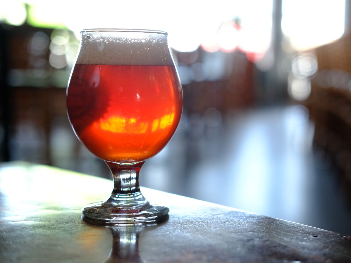 A frosty glass of ruby-colored sour beer.