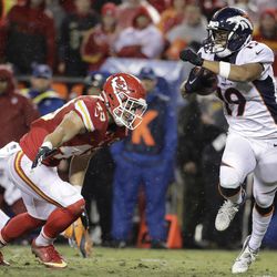 Denver Broncos wide receiver Kalif Raymond (19) tries to avoid Kansas City Chiefs defensive back Daniel Sorensen (49) during the first half of an NFL football game in Kansas City, Mo., Sunday, Dec. 25, 2016. (AP Photo/Charlie Riedel)