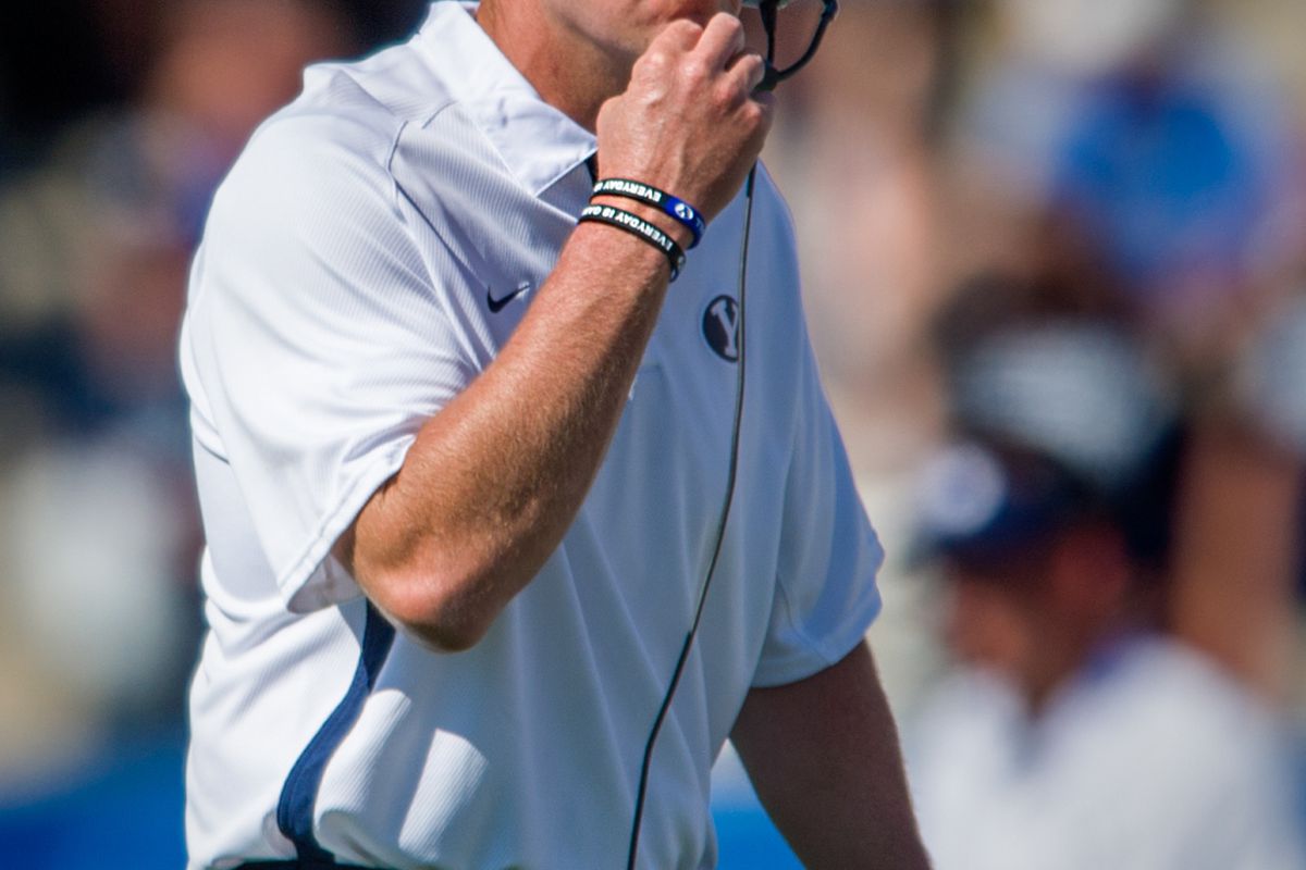 Sept. 8, 2012; Provo, UT, USA; Brigham Young Cougars head coach Bronco Mendenhall talks on his radio set during the third quarter against the Weber State Wildcats at LaVell Edwards Stadium. Mandatory Credit: Douglas C. Pizac-US PRESSWIRE