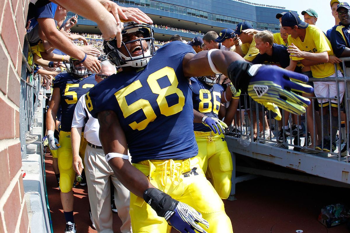 ANN ARBOR, MI - SEPTEMBER 03: Brandon Herron #58 of the Michigan Wolverines runs onto the field prior to playing the Western Michigan Broncos at Michigan Stadium on September 3, 2010 in Ann Arbor, Michigan. (Photo by Gregory Shamus/Getty Images)