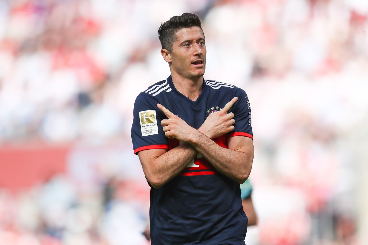 COLOGNE, GERMANY - MAY 05: Robert Lewandowski #9 of Bayern Munich celebrates after scoring a goal to make it 1-2 during the Bundesliga match between 1. FC Koeln and FC Bayern Muenchen at RheinEnergieStadion on May 5, 2018 in Cologne, Germany.