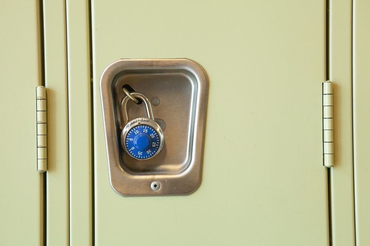 A close-up of a locker and a blue lock in a Chicago high school.
