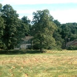 This view shows structures on what was once the Isaac Morley farm before they were owned by the LDS Church. The home and outbuilding postdate the LDS period of Kirtland's history. The outbuilding no longer stands.