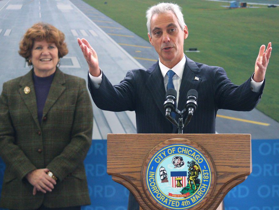 Mayor Rahm Emanuel speaks at the commissioning of runway 10R-28L as Chicago aviation commissioner Ginger Evans looks on at O’Hare Airport in  2015. File Photo. | Tim Boyle/For the Sun-Times