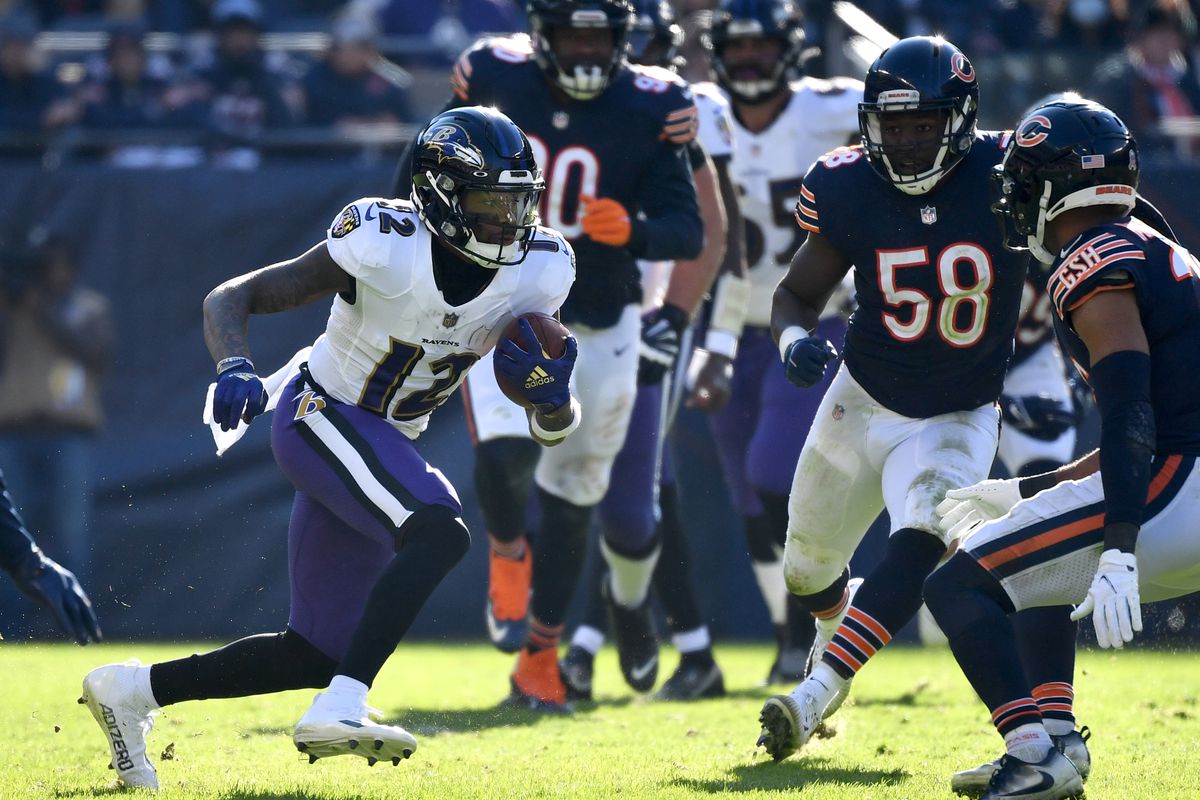 Rashod Bateman #12 of the Baltimore Ravens runs the ball in the game against the Chicago Bears during the third quarter at Soldier Field on November 21, 2021 in Chicago, Illinois.