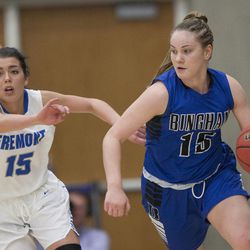 Bingham's Maggie Mccord brings the ball up the court while followed by Fremont's Mazzie Melaney during Fremont's 61-47 victory against Bingham in the Class 6A state championship game at Salt Lake Community College in Taylorsville on Saturday, Feb. 24, 2018.