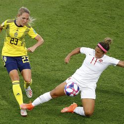 Canada's Desiree Scott, right, tackles Sweden's Elin Rubensson during the Women's World Cup round of 16 soccer match between Sweden and Canada at the Parc des Princes in Paris, France, Monday, June 24, 2019. (AP Photo/Michel Euler)