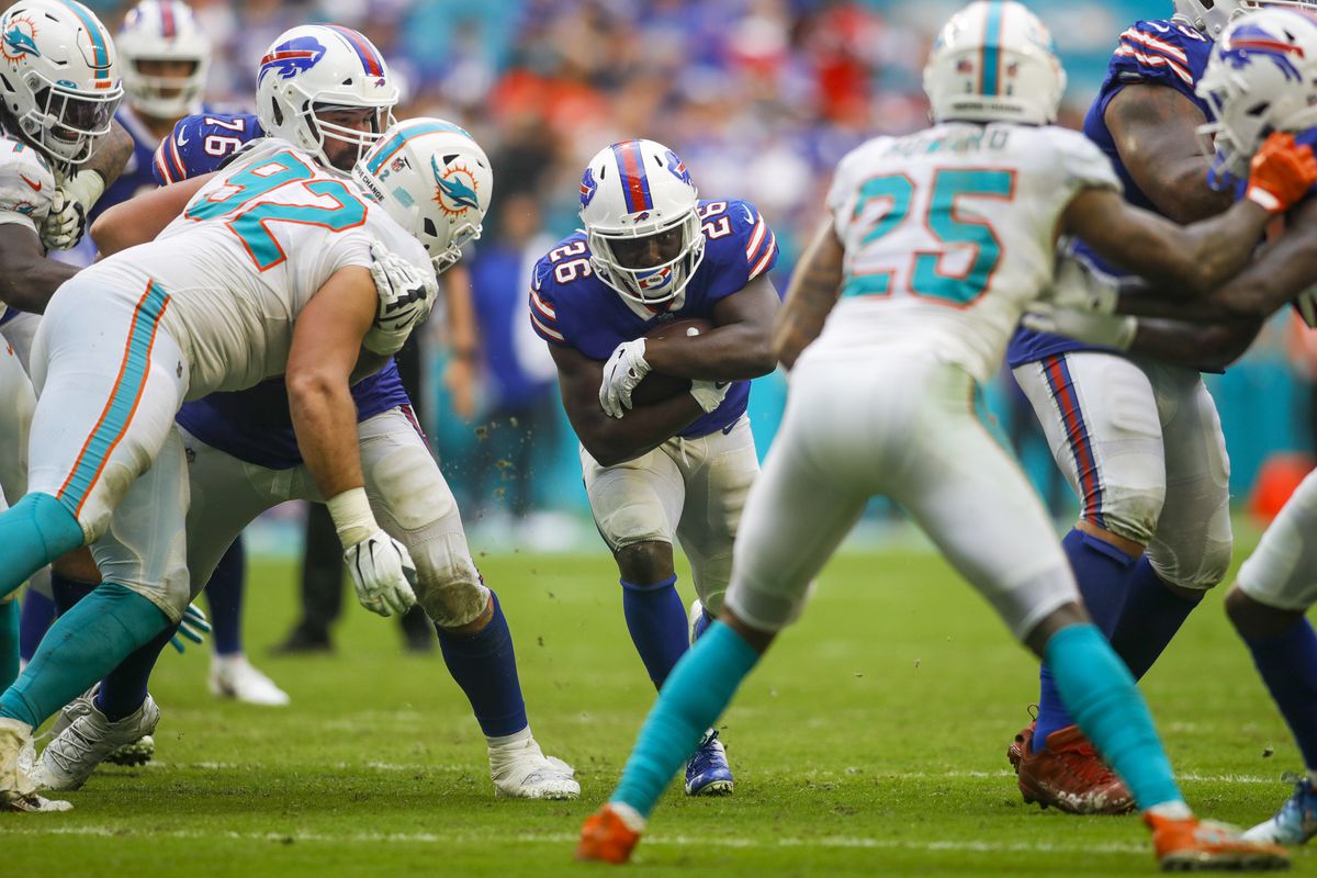 Buffalo Bills running back Devin Singletary (26) runs with the football during the fourth quarter of the game against the Miami Dolphins at Hard Rock Stadium.