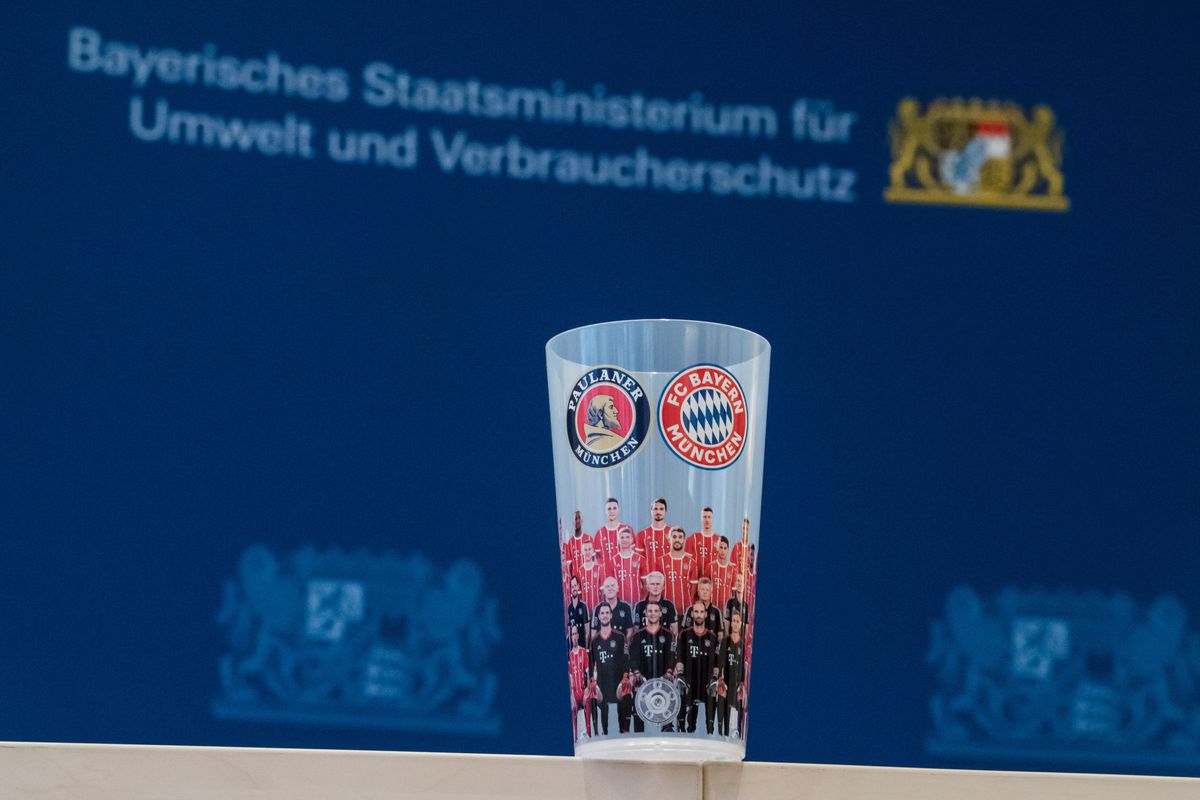 MUNICH, GERMANY - NOVEMBER 28:  A reusable cup with the logo of FC Bayern Muenchen sits on a table before a press conference at the Bayerische Staatsministerium fuer Umwelt und Verbraucherschutz (Bavarian ministry for the environment and consumer protection) on November 28, 2017 in Munich, Germany. (Photo by Sebastian Widmann/Bongarts/Getty Images)