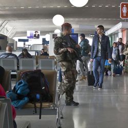 French soldiers patrol at Charles de Gaulle airport, in Roissy, north of Paris, Tuesday, March 22, 2016. Authorities are tightening security at airports and on the streets of European cities after attacks on the Brussels airport and subways system that killed at least 34 people and injured many others. Security has been beefed up in France, Austria, Poland and the Czech Republic.