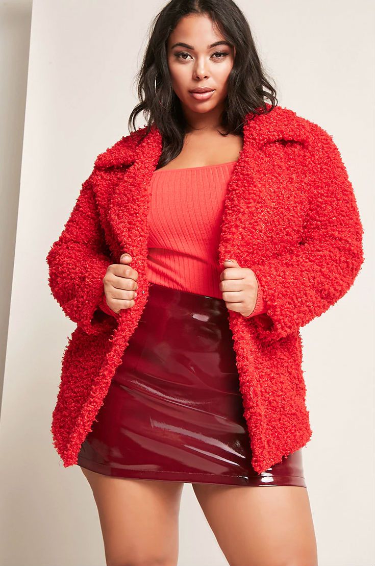 A model in a red knit jacket