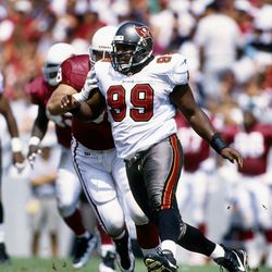 Sep 28, 1997; Tampa, FL, USA; FILE PHOTO; Tampa Bay Buccaneers defensive tackle Warren Sapp (99) in action against the Arizona Cardinals at Tampa Stadium. The Bucs defeated the Cardinals 19-18. Mandatory Credit: USA TODAY Sports