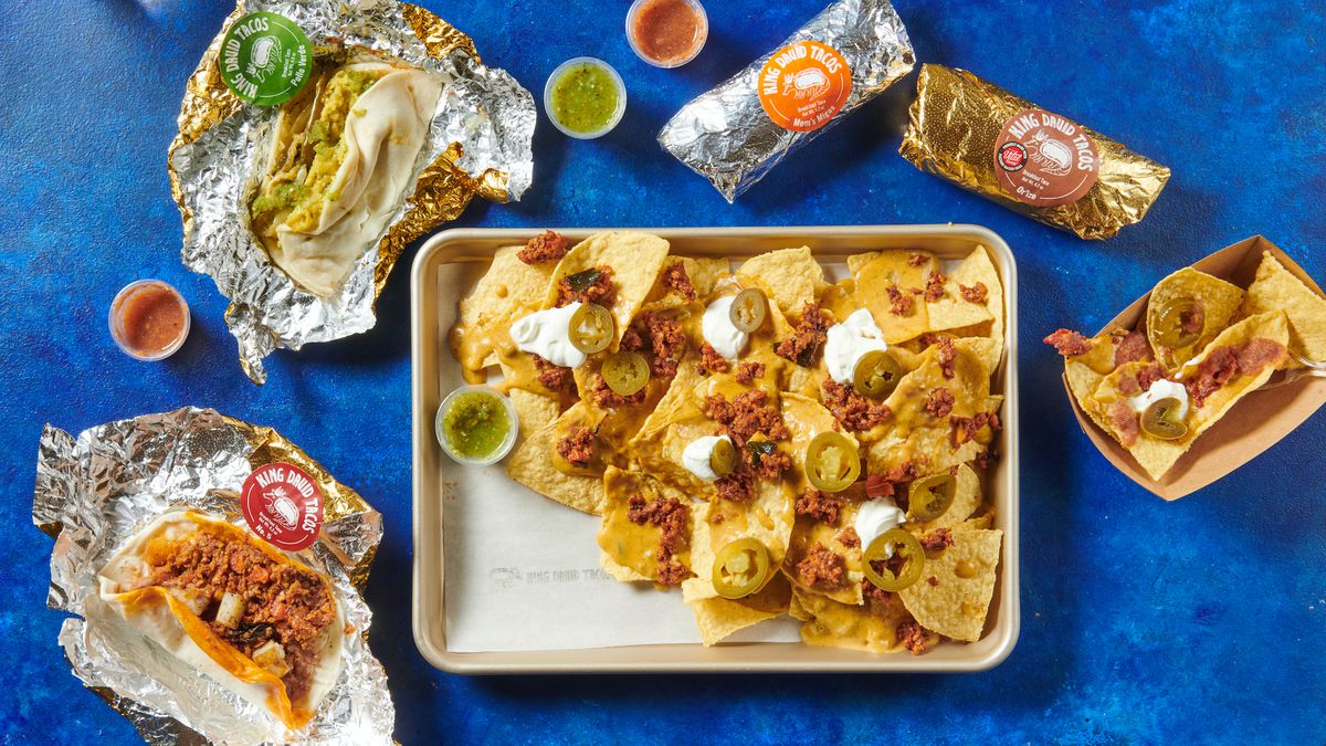A spread of nachos and Austin-style tacos at King David Tacos