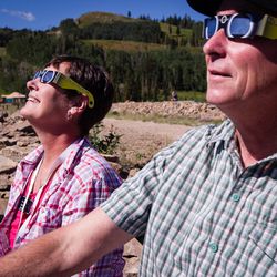 Lee Enyart, left, and Jeff Enyart view the waxing eclipse at Park City Mountain in Park City on Monday, Aug. 21, 2017. The partial eclipse was at 90 percent of totality in Park City.