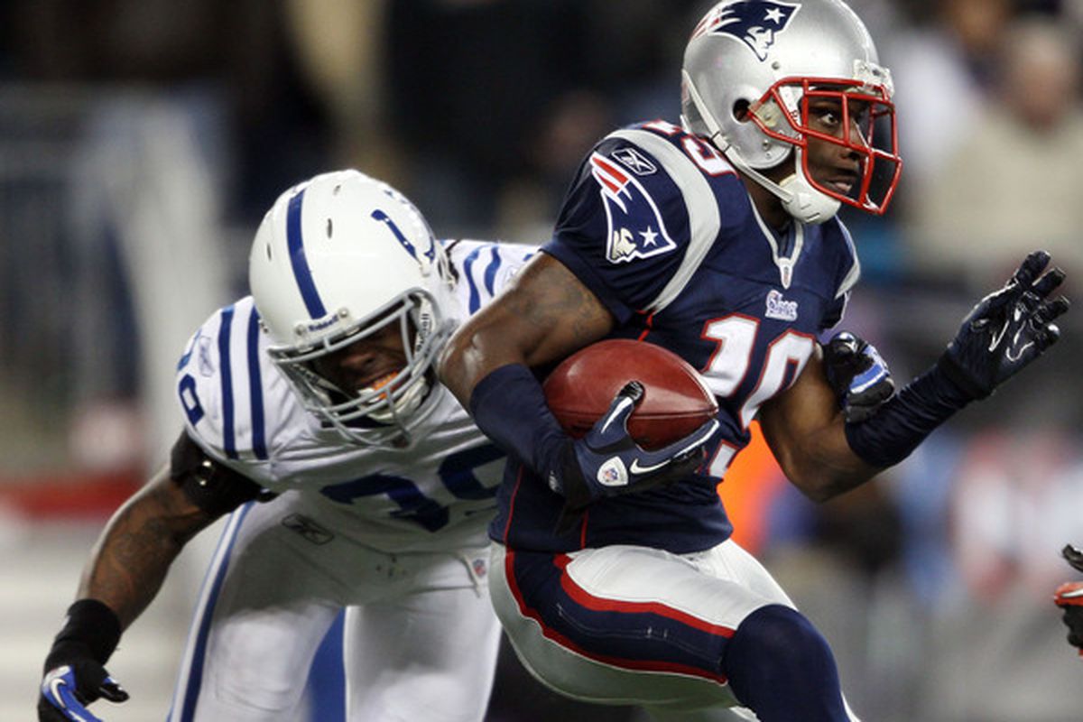 FOXBORO MA - NOVEMBER 21:   Brandon Tate #19 of the New England Patriots carries the ball as Cornelius Brown #39 of the Indianapolis Colts defends on November 21 2010 at Gillette Stadium in Foxboro Massachusetts. (Photo by Elsa/Getty Images)