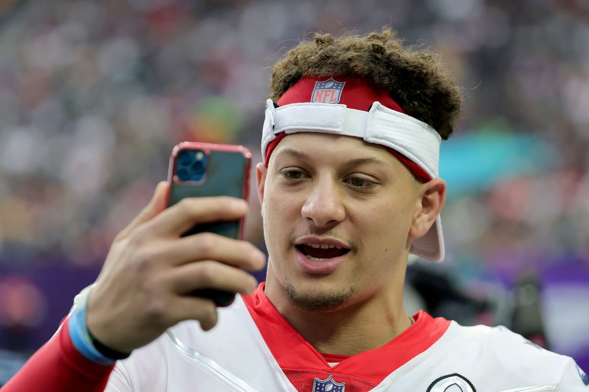 Patrick Mahomes #15 of the Kansas City Chiefs and AFC records a video message on a sideline during the 2022 NFL Pro Bowl against the NFC at Allegiant Stadium on February 06, 2022 in Las Vegas, Nevada. The AFC defeated the NFC 41-35.