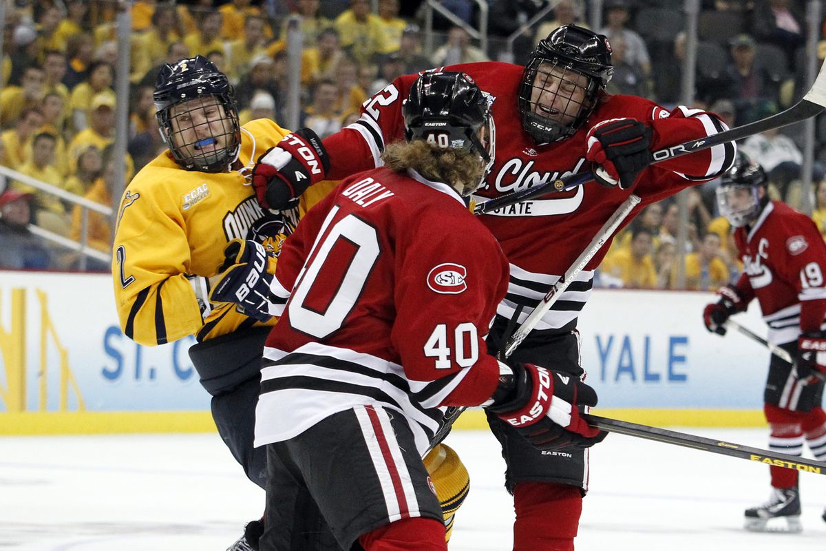 Brodzinski delivers a check at the 2013 Frozen Four