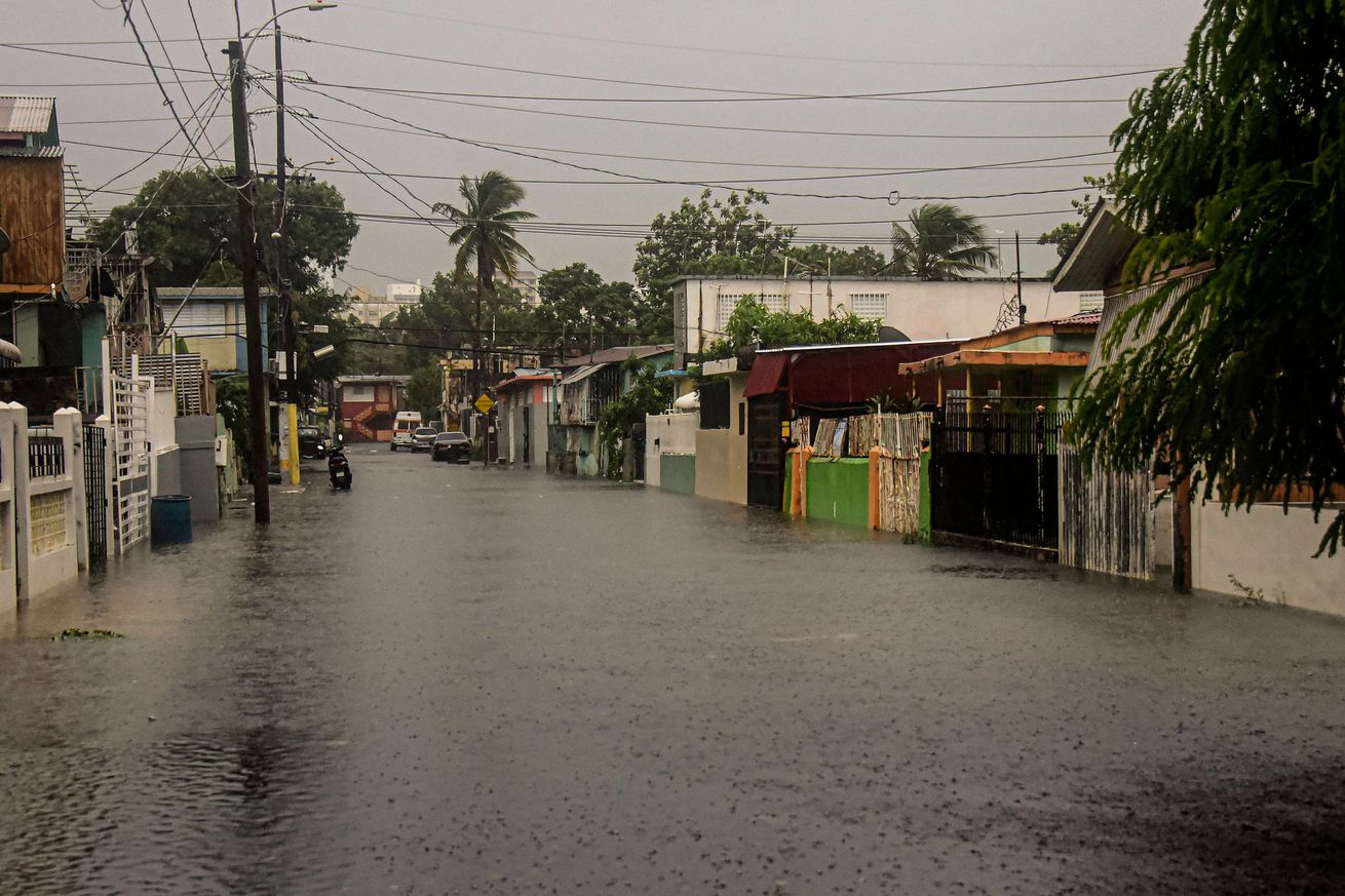 A flooded road is seen during the passage of hurricane Fiona in Villa Blanca, Puerto Rico, on September 18, 2022.