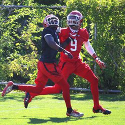 Freshman defensive back Jaylon Johnson competes against senior wide receiver Darren Carrington II during the first day of the University of Utah's fall camp Friday, July 28, 2017.