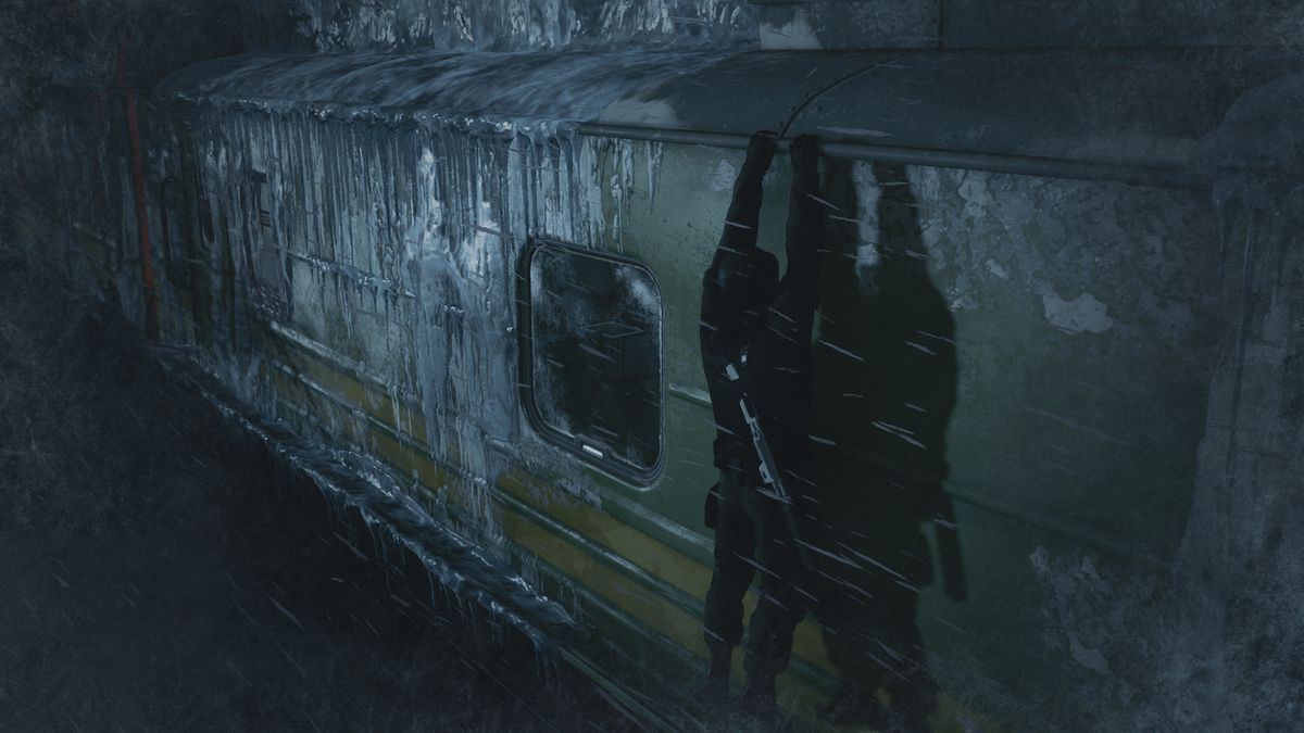 Agent 47 wearing a commando outfit with a gun slung over his back as he hangs from the top of an iced-over train in Hitman 3’s Carpathian Mountains level
